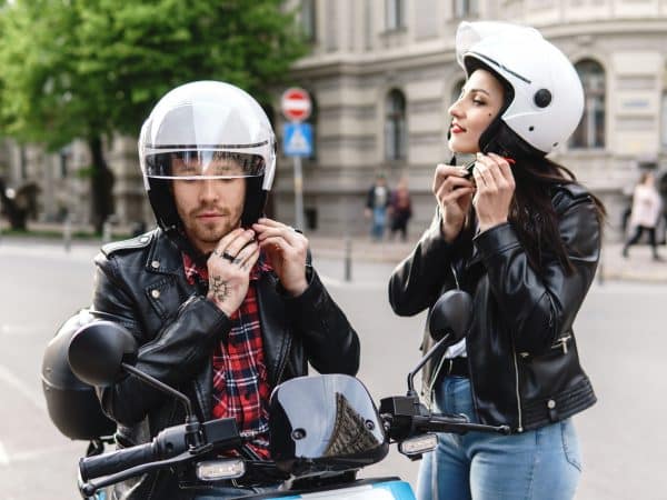 stylish couple wearing motorcycle helmets before r 2023 11 27 05 18 47 utc